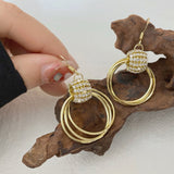 Boucles D'oreilles Géométriques Superposées en Diamant