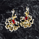 Boucles d'oreilles puces rubis cerclées d'or