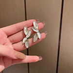 Boucles d'Oreilles Inspiration Feuille Brillante