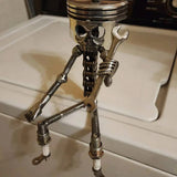 Sculpture de visage de crâne de piston