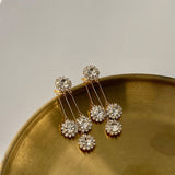 Boucles d'oreilles avec pétales ronds en zircone