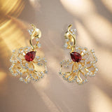 Boucles d'oreilles puces rubis cerclées d'or