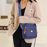 Sac à bandoulière léger et décontracté avec plusieurs poches pour femme