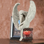Ornement d'ange tenant une jambe