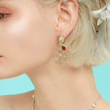 Boucles d'oreilles puces rubis cerclées d'or