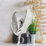 Ornement d'ange tenant une jambe