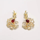 Boucles d'oreilles puces rubis cerclées d'or