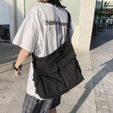 Sac messager en toile de couleur unie