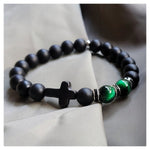 Bracelet de perles d'ambre à croix intérieure