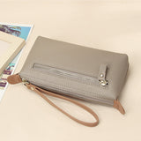 Pochette en cuir légère avec grand espace et fermeture éclair au poignet