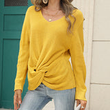 Pull en tricot noué