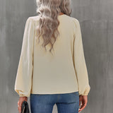 Chemisier uni à manches bouffantes et encolure ronde