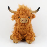 Vache des hautes terres portant des fleurs