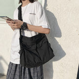 Sac messager en toile de couleur unie