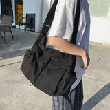 Sac messager en toile de couleur unie