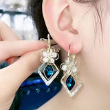 Boucles d'Oreilles Fleur Zircon Rhombique Saphir