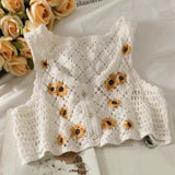 Gilet en tricot à marguerites