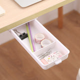 Sous le tiroir de rangement du bureau