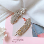 Barrette à plumes de diamant