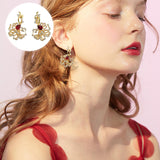 Boucles d'oreilles puces rubis cerclées d'or