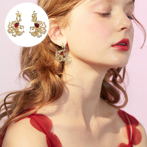 Boucles d'oreilles puces rubis cerclées d'or