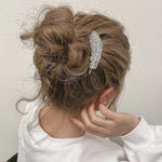 Barrette à plumes de diamant