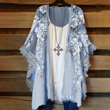 Cardigan en dentelle avec empiècements fleuris