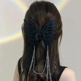 Grande pince à cheveux avec pompon et découpe papillon