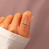 Bague enveloppante croix micro pavée