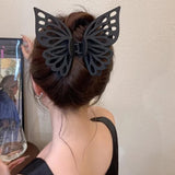 Grande pince à cheveux avec pompon et découpe papillon