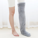 Chaussettes chauffantes aux genoux