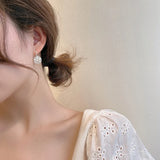 Boucles d'oreilles marguerites élégantes