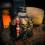 Bouteille de rhum tête de mort pirate en résine