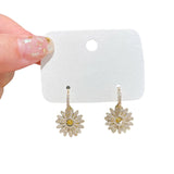 Boucles d'oreilles marguerites élégantes