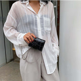 Mini sac à cosmétiques à bandoulière