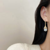 Boucles D'oreilles En Perles D'opale Á La Mode