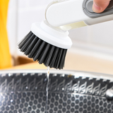 Brosse à pot avec distribution automatique de liquide