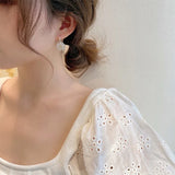 Boucles d'oreilles marguerites élégantes