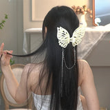 Grande pince à cheveux avec pompon et découpe papillon