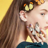 Boucles d'Oreilles Grimpeur Papillon à la Mode à l'Intérieur