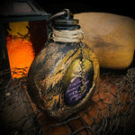 Bouteille de rhum tête de mort pirate en résine