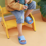 Chaussons antidérapants pour enfants avec dinosaures de dessin animé