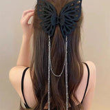 Grande pince à cheveux avec pompon et découpe papillon
