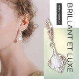 Boucles d'Oreilles Oeil de Chat Brillantes