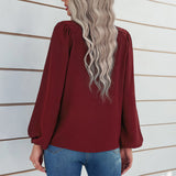 Chemisier uni à manches bouffantes et encolure ronde