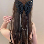 Grande pince à cheveux avec pompon et découpe papillon