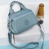 Sac à main fonctionnel à plusieurs compartiments de couleur unie