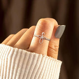 Bague enveloppante croix micro pavée