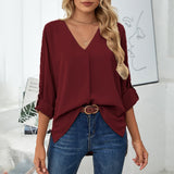 Chemise élégante ample à col en V