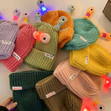 Petit bonnet de monstre lumineux